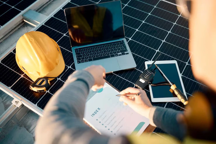 engineer-laptop-man-with-clipboard-planning-update-system-with-manual-hard-hat-fix-problems-male-employee-business-owner-leader-with-device-maintenance-upgrade-solar-panels_590464-132229
